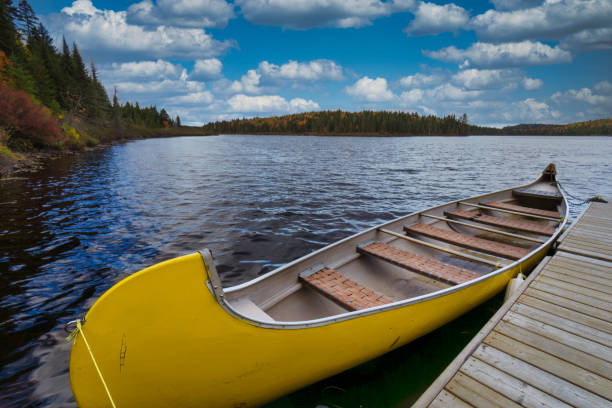 istock Orange Yellow canoe on a lake. 1340311366