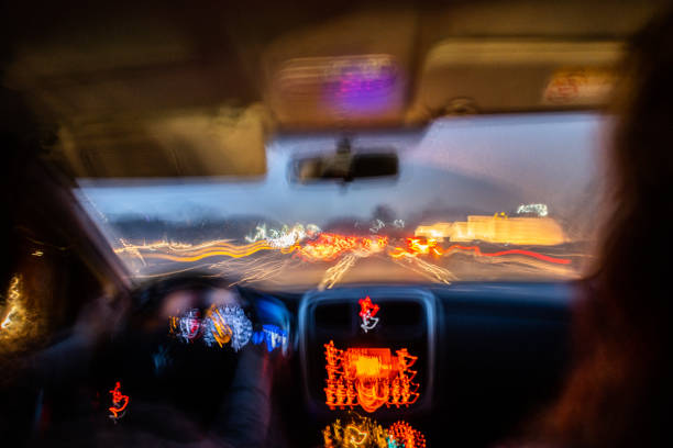 View from inside a car at night Blurred photo from inside a car at night drunk driving stock pictures, royalty-free photos & images