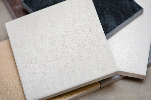 istock Samples of natural stone for kitchen countertops and floor tiles. Stone samples for countertops on gray background, copy space for design or text 1340320019