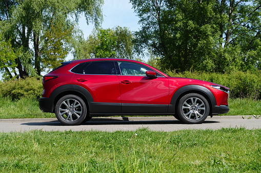 Berlin, Germany - 21 May, 2021: Mazda CX-30 stopped on a street. This model is one of the most popular Mazda cars.