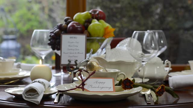 Elegant formal Thanksgiving table in front of garden window