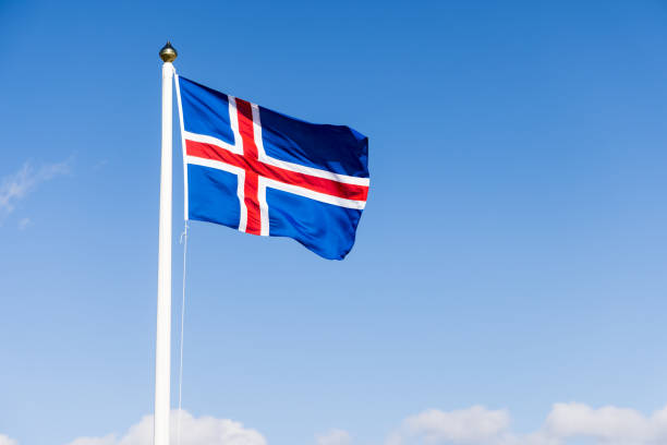 Icelandic Flag Against Blue Summer Sky Iceland National Flag stock photo