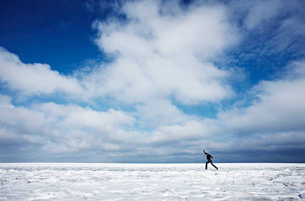 istock Man jumping in winter landscape 134035695