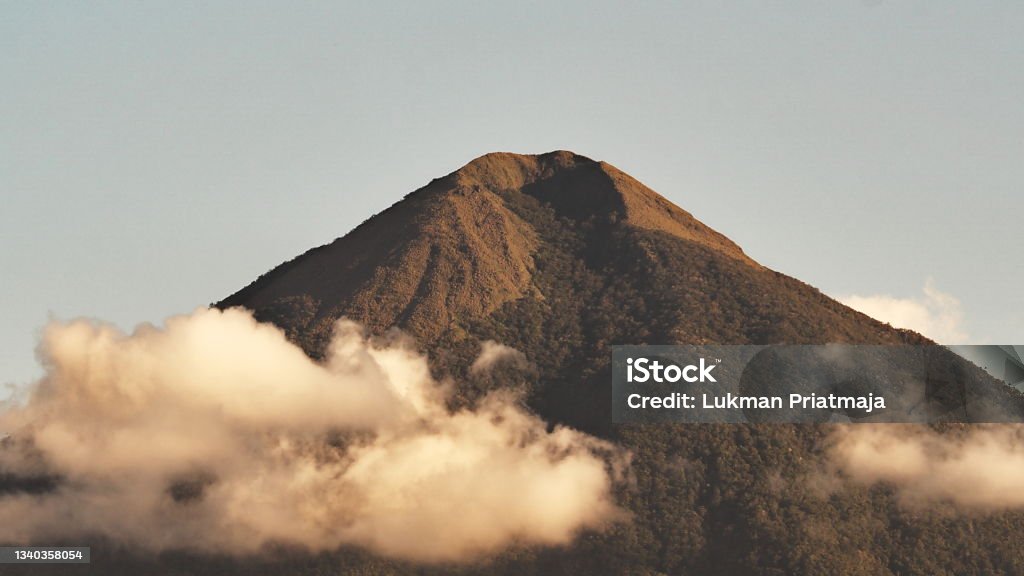 Top of Mount Kie Matubu with cloud, Tidore, Maluku Utara, Indonesia at sunset - stock photo Top of Mount Kie Matubu, Tidore, Maluku Utara, Indonesia at sunset, view from ternate Beauty In Nature Stock Photo