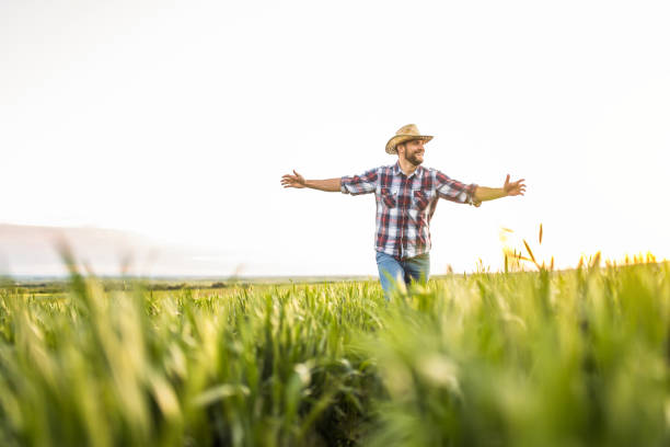 istock Young farmer running on an agricultural field. 1340358147