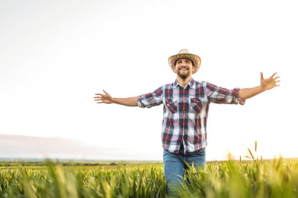 istock Young farmer running on an agricultural field. 1340358337