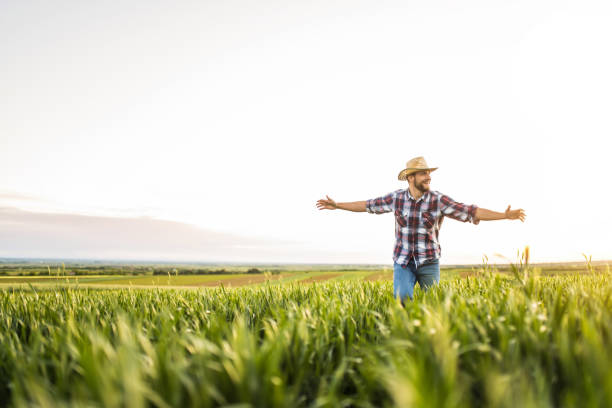 istock Young farmer running on an agricultural field. 1340358347