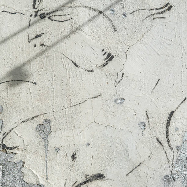 istock Old cement wall, cracks and stains of paint, peeling paint texture, for background 1340359094