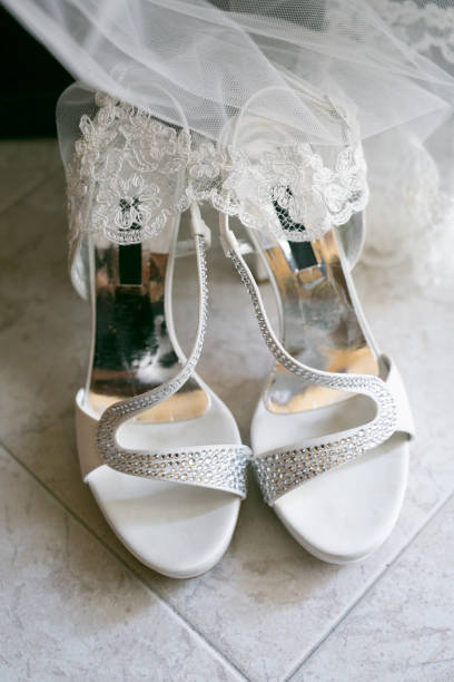 istock White wedding shoes with glitter and veil 1340364986