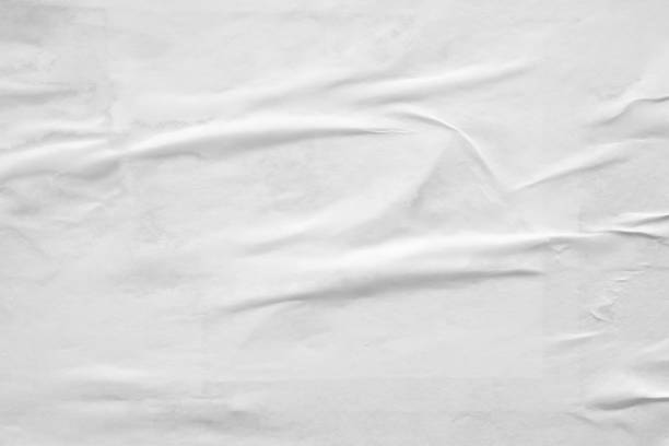istock white crumpled and creased paper poster texture background 1340367776