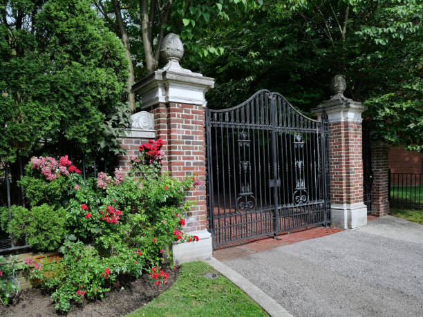 istock gated home or mansion, with climbing rose bushes 1340373444