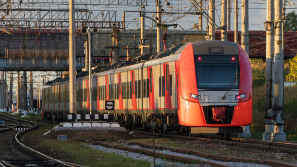 istock Modern intercity high speed train under the bridge on railroad at sunset 1340373607