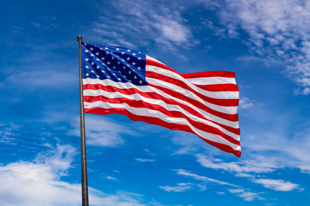 istock USA flag waving against sky 1340381094