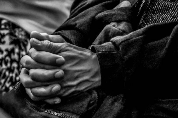 istock Human hand praying to God. 1340386393