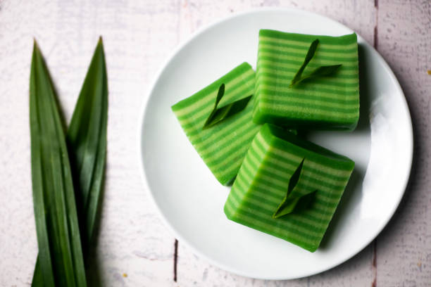 istock Kue lapis means layers cake, Indonesian traditional food. Made using soft rice flour pudding, it usually consists of two layers of different colors, grey and green 1340386513