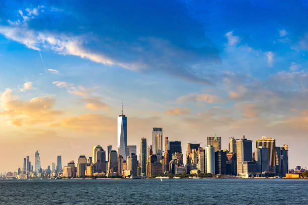 Manhattan cityscape in New York Panoramic view of Manhattan cityscape in New York City at sunset, NY, USA lower manhattan stock pictures, royalty-free photos & images
