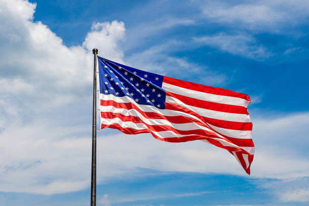 istock USA flag waving against sky 1340398000