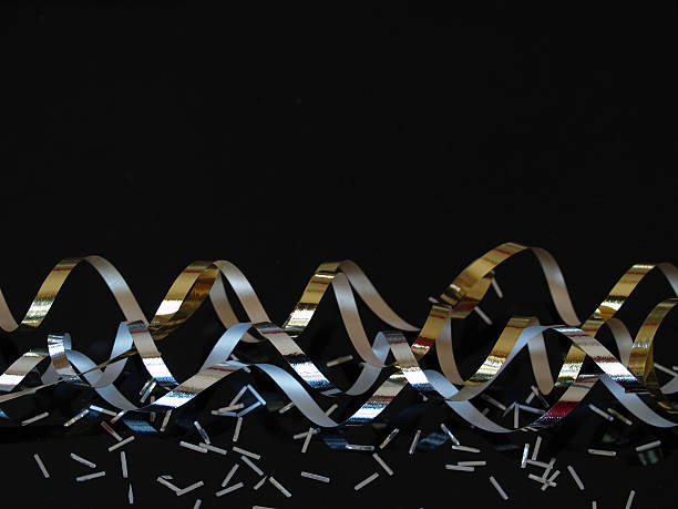 Silver And Gold Streamers On Black Stock Photo - Download Image Now - Black  Background, Confetti, Silver - Metal - iStock