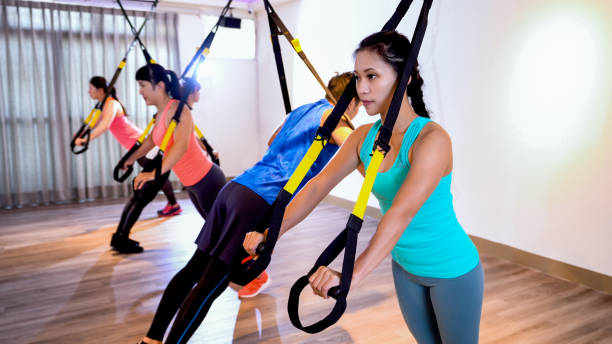istock group of friends using TRX for their exercises 1340398860