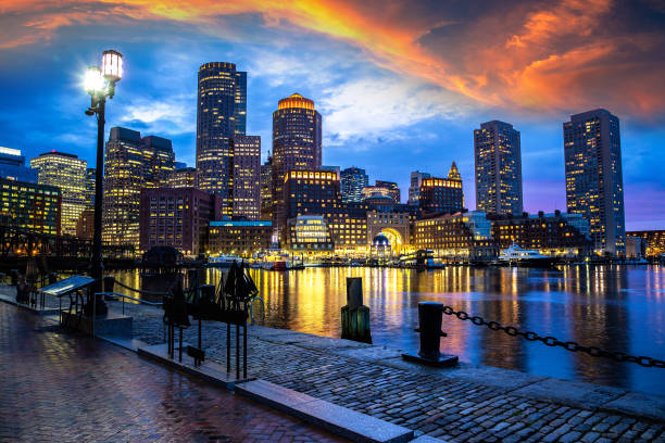 Boston cityscape at night Panoramic view of Boston cityscape at Fan Pier Park 
at night, USA boston massachusetts stock pictures, royalty-free photos & images