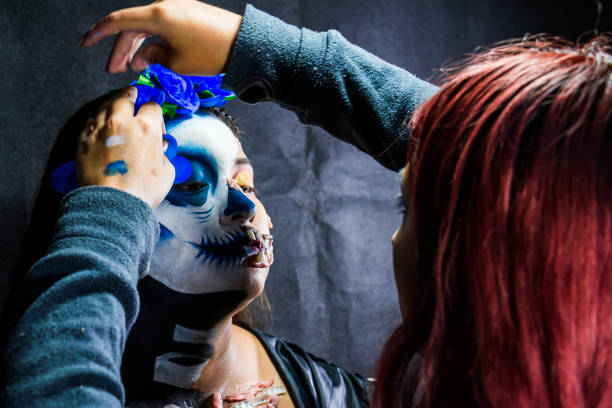 istock Backstage makeup. Women doing Halloween makeup, people in professional makeup artist training. 1340400865