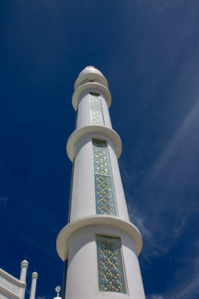 istock Minaret of al hakim white mosque againts blue sky 1340402029