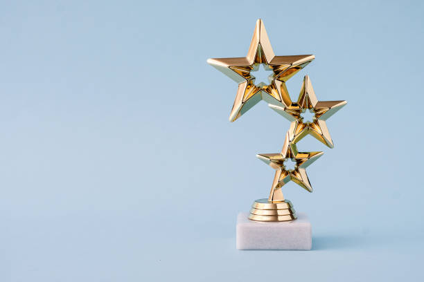 three star awards for leader and ranking. golden shiny prize on a pastel blue background. - rank imagens e fotografias de stock