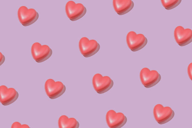 istock Pink hearts on a pastel background for congratulations on Valentine's day or other event. 1340403448