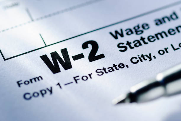 Pen on a Form W-2 Wage and Tax Statement stock photo