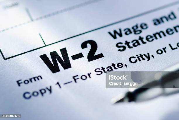Pen On A Form W2 Wage And Tax Statement Stock Photo - Download Image Now - Tax Form, Form - Document, Tax