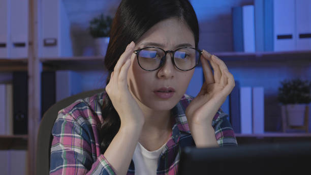 istock student holding eyeglasses trying to concentrate 1340407503