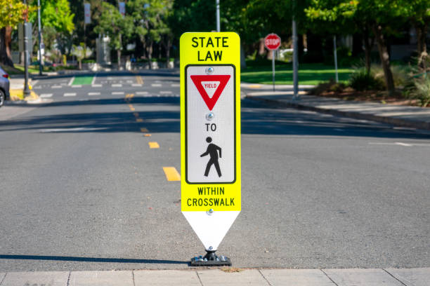State Law Yield for Pedestrians Within Crosswalk reboundable road sign State Law Yield for Pedestrians Within Crosswalk reboundable road sign. pedestrian stock pictures, royalty-free photos & images