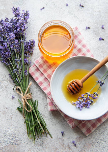 istock Jar with honey and fresh lavender flowers 1340411887