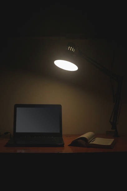 istock Front view on landscapes laptop display on the table with book and lamp 1340412243