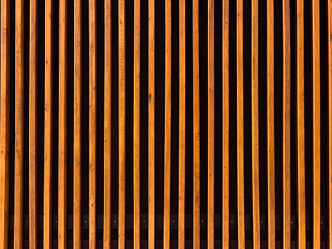 Stack of hardwood planks, wooden background
