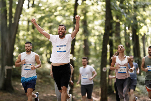 istock Cheerful athlete celebrating his success in marathon race. 1340416262