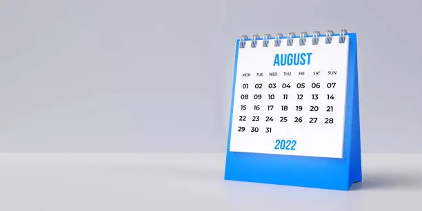 Photo of Blue August desk calendar 2022 on blank background with copy space.