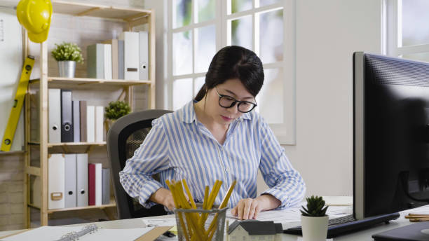 istock designer with pen and ruler in hand drawing 1340422101