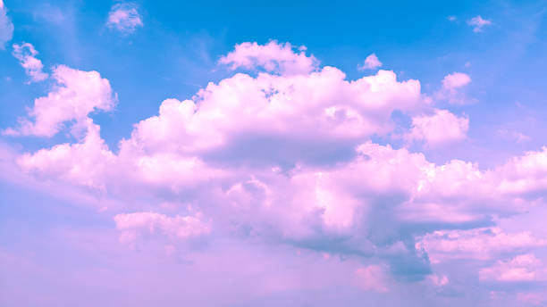 istock cloudy pink and blue color background 1340422390