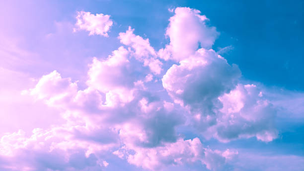 istock cloudy pink and blue color background 1340422393