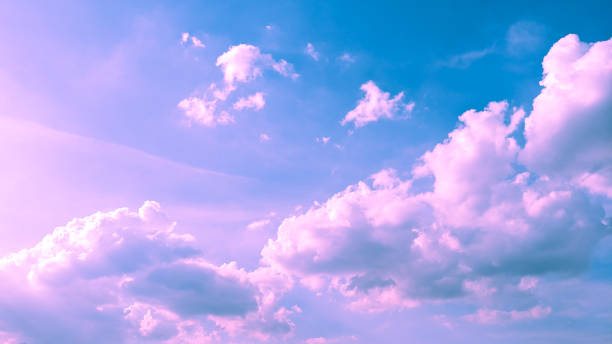 istock cloudy pink and blue color background 1340422528