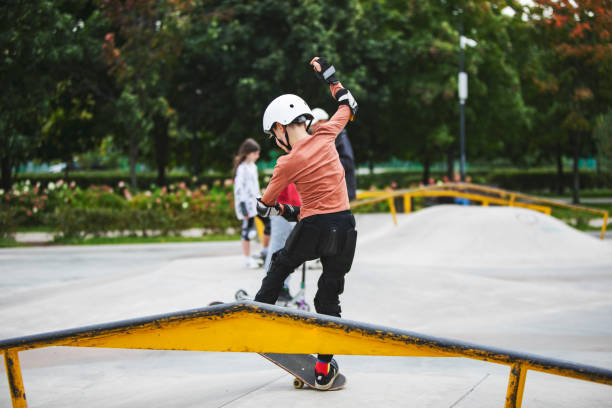 istock Little boy skateboarding in park 1340422719