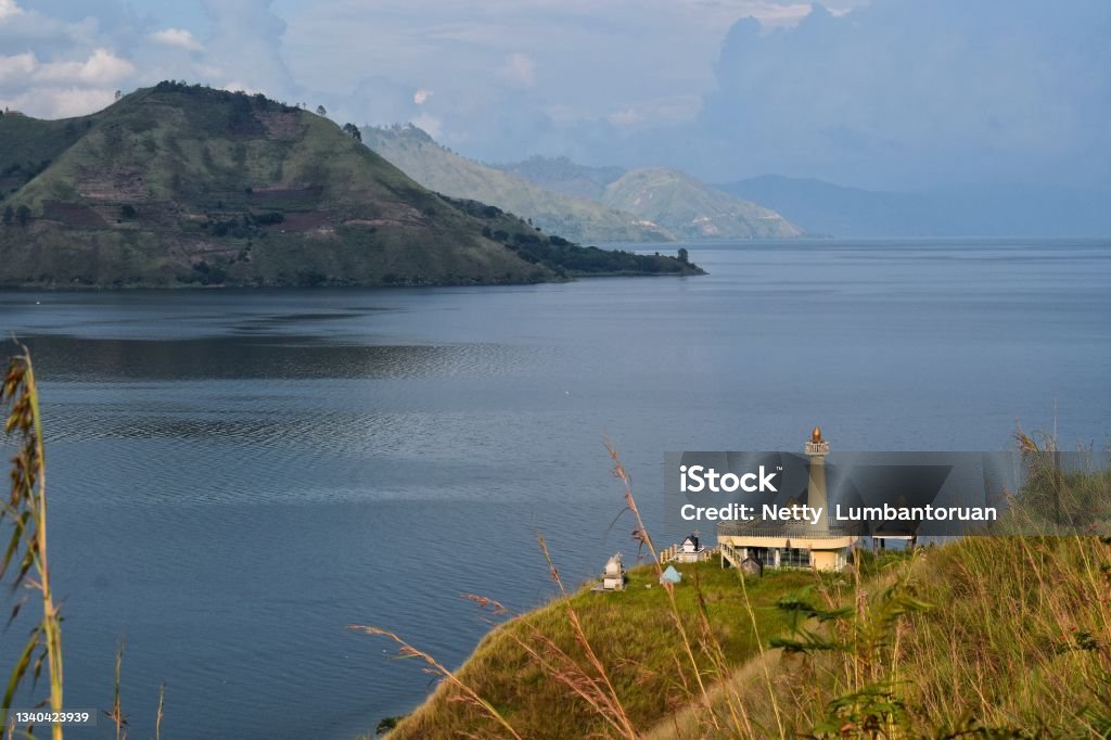 "Tugu or Simin" is a grave of the Toba Batak tribe in the form of a house on the outskirts of Lake Toba, Paropo and Silalahi villages, North Sumatra, Indonesia. Beauty In Nature Stock Photo