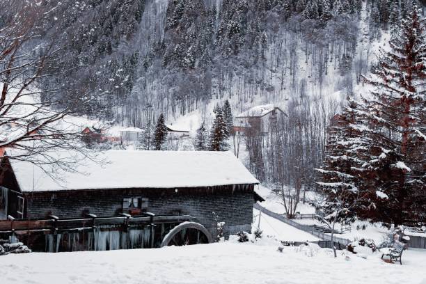 istock Chalet in snow by mountain in the Alps. 1340424021