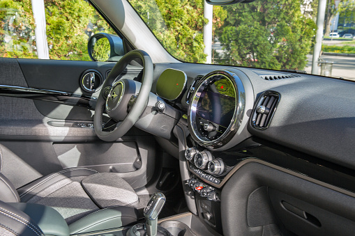 Kyiv, Ukraine - May 10, 2021: New MINI Cooper Countryman diesel car interior. Mini is a compact city car that was produced by the English British Motor Corporation.
