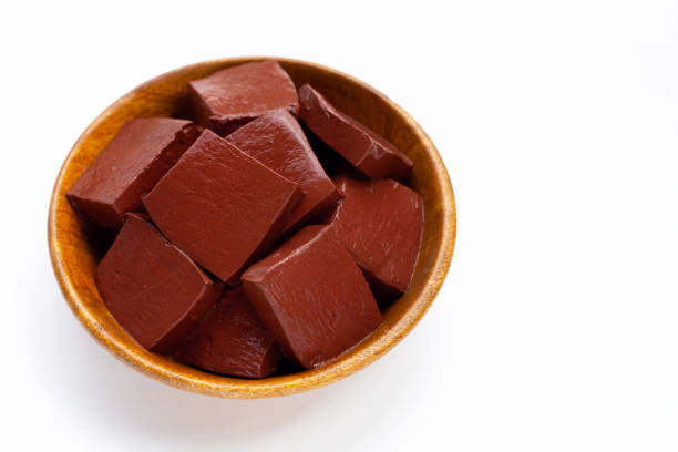 istock Pork blood pudding in wooden bowl on white background. 1340425554