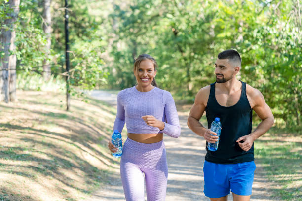 istock Friends jogging in the park 1340427197