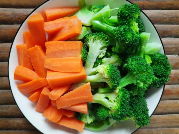 istock Broccoli and Carrot vegetables on plate. 1340427855