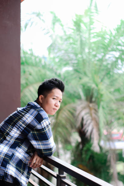 istock Young men relaxing at city park 1340428999