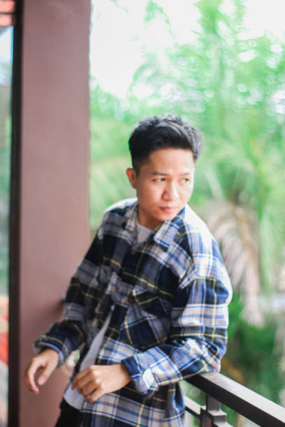 istock Young men relaxing at city park 1340429000